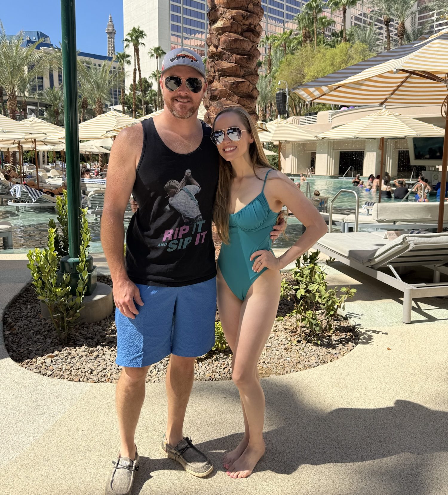 Couple posing at the Flamingo pool in Las Vegas.